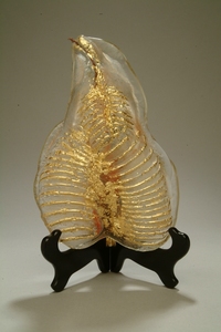 <div class='title'>Radiate</div><br>Sand-cast glass/Copper and Gold Leaf<br>11.5"h x 8"w x 4.5"d<br>