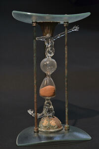 <div class='title'>Time For Change</div><br>Flameworked (solid and blown) glass, sand, metal parts (vintage and new),  artist-wrought iron, glass, fescue seed <br>14.5"w x 8"h x 8"d <br>