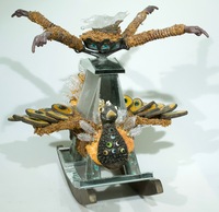 <div class='title'>Lookout</div><br>flameworked, kiln-fused, kiln-cast glass;<br> mirror, sheet glass, springs, moss, egg shells, acrylics, vintage toaster<br>22"h x 19"w x 18"d<br>