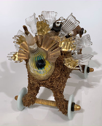 <div class='title'>Caretakers</div><br>flameworked, kiln-cast and fused glass, vintage heater and metals, acrylics<br>14"h x 11"w x 21"d<br>