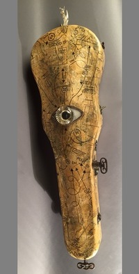 <div class='title'>Ancestral Tunes</div><br>flameworked glass, vintage violin case, mirror, vintage sewing patterns, mixed media. <br><a href='videos/644.mov' target=_blank>VIDEO!</a><br>35"h x 10"w x 4"d<br>