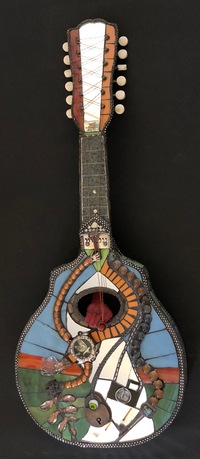 <div class='title'>Mandel-Inn</div><br>cast and flameworked glass, mandolin, mixed media <br>26"h x 10"w x 40"d<br>NFS