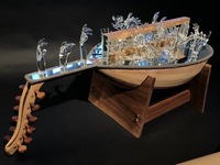 <div class='title'>Reach</div><br>Flameworked hands, mirror, sheet glass, oud, black walnut base<br>35"l x 16.5"w x 16.5"h<br>