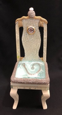 <div class='title'>Insight (Hazak) Chair</div><br>flameworked glass eye, artist-fused glass, sheet glass, watch parts, brass chain<br><br>SOLD