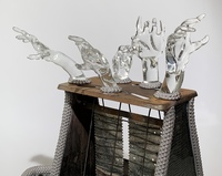 <div class='title'>Life Boat</div><br>Flameworked figures, hands and eyes, mirror, vintage toaster, artist-painted ceramic boat, metal chain, grout<br>17"h x 17"w x 17"d<br>